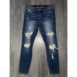Never worn dark blue distressed denim